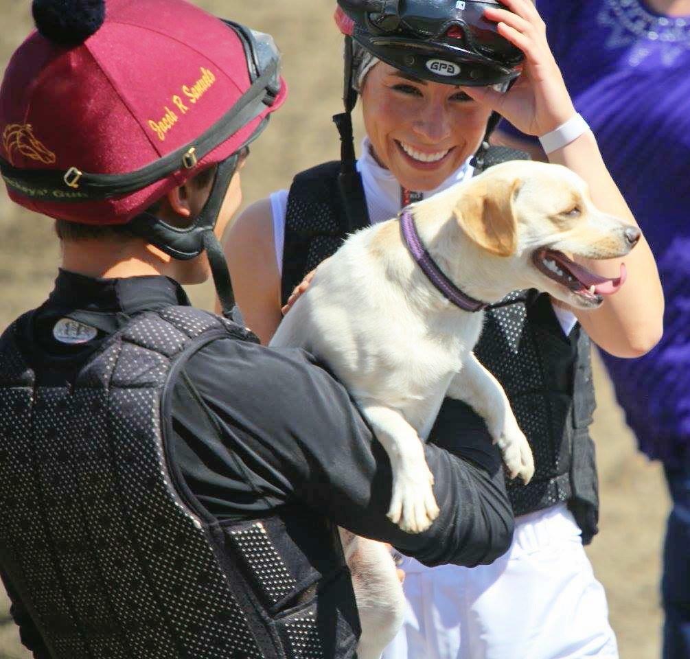 Jake and Kassie with their dog, Jersey, after he won the dog race at Sun Downs racetrack in Kennewick, Wash. (Courtesy of Kassie Guglielmino)
